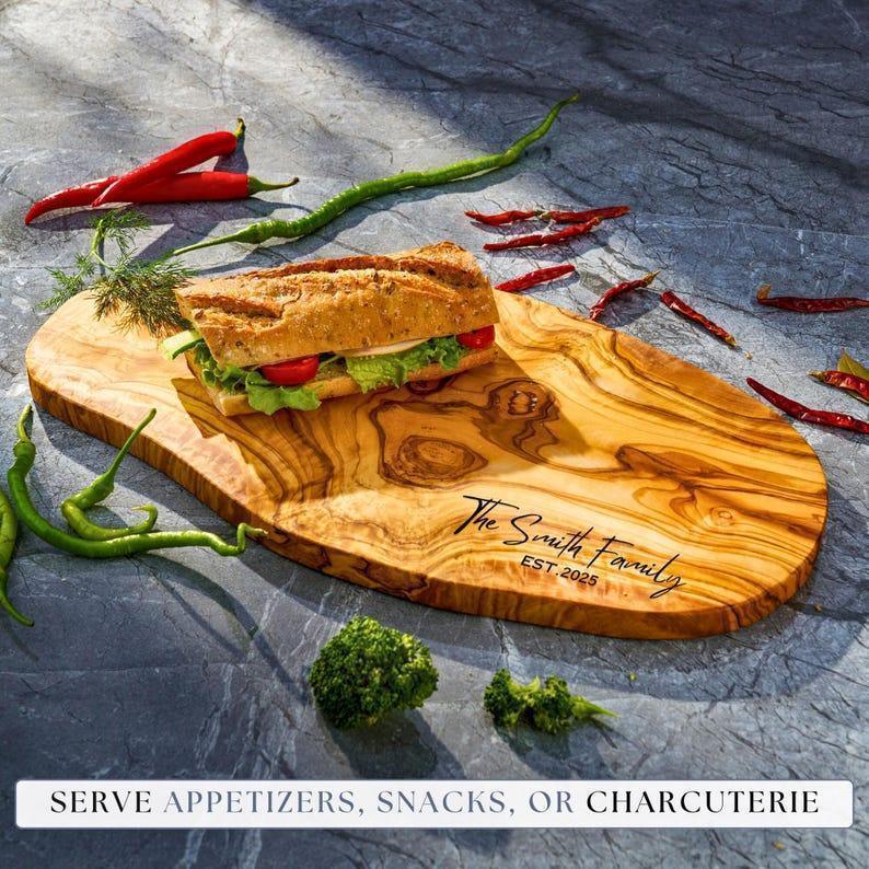 Personalized custom engraved olive wood cutting board as a gift for husband and wife