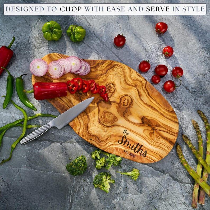Personalized custom engraved olive wood cutting board as a gift for husband and wife