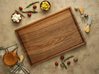 Carved walnut wood cutting boards are available for personalized customization